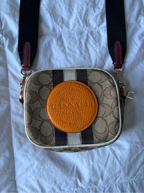 Coach Tan Signature Canvas Crossbody camera bag with Orange Leather Patch